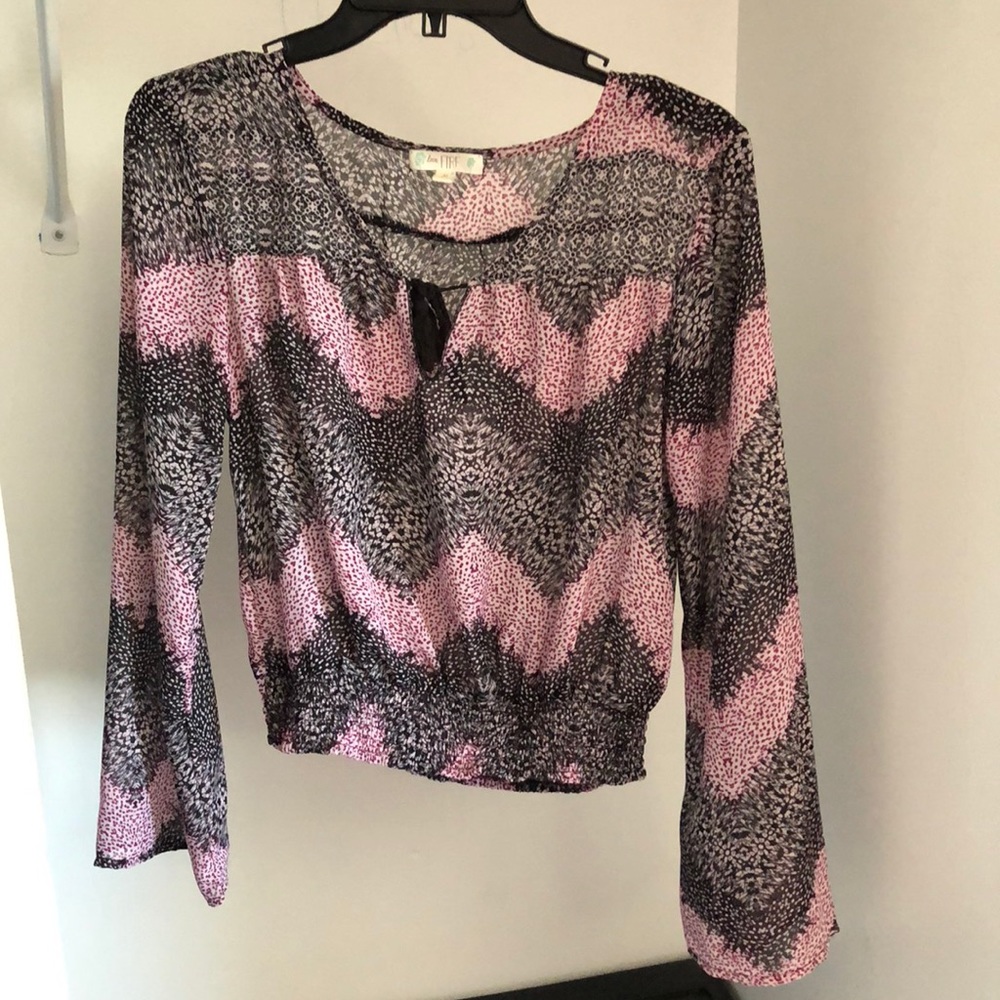 Flowy pink and black shirt.